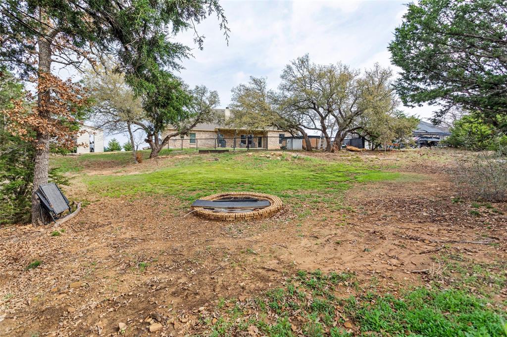 223 Cottongame Road Weatherford, TX 76088 - Photo 30 of 35 a view of a house with a yard