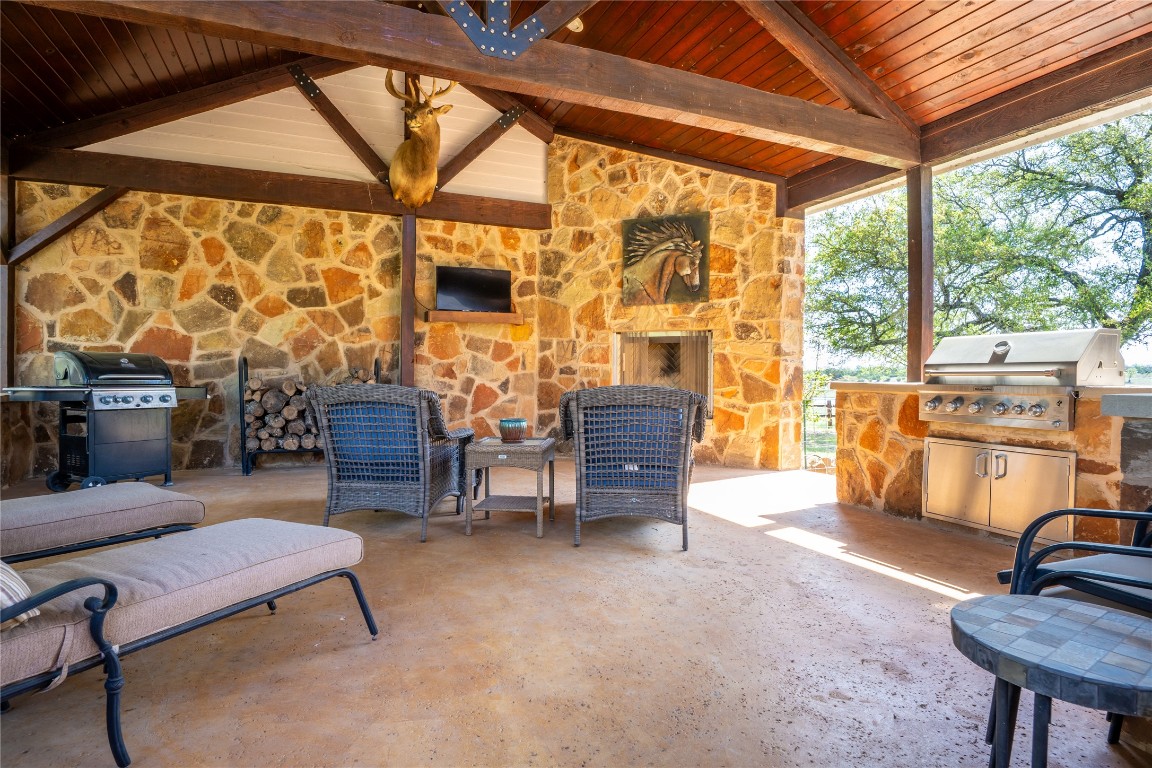 5525 Fm2340 Road Burnet, TX 78611 - Photo 14 of 39 View of patio with an outdoor fireplace and area for grilling