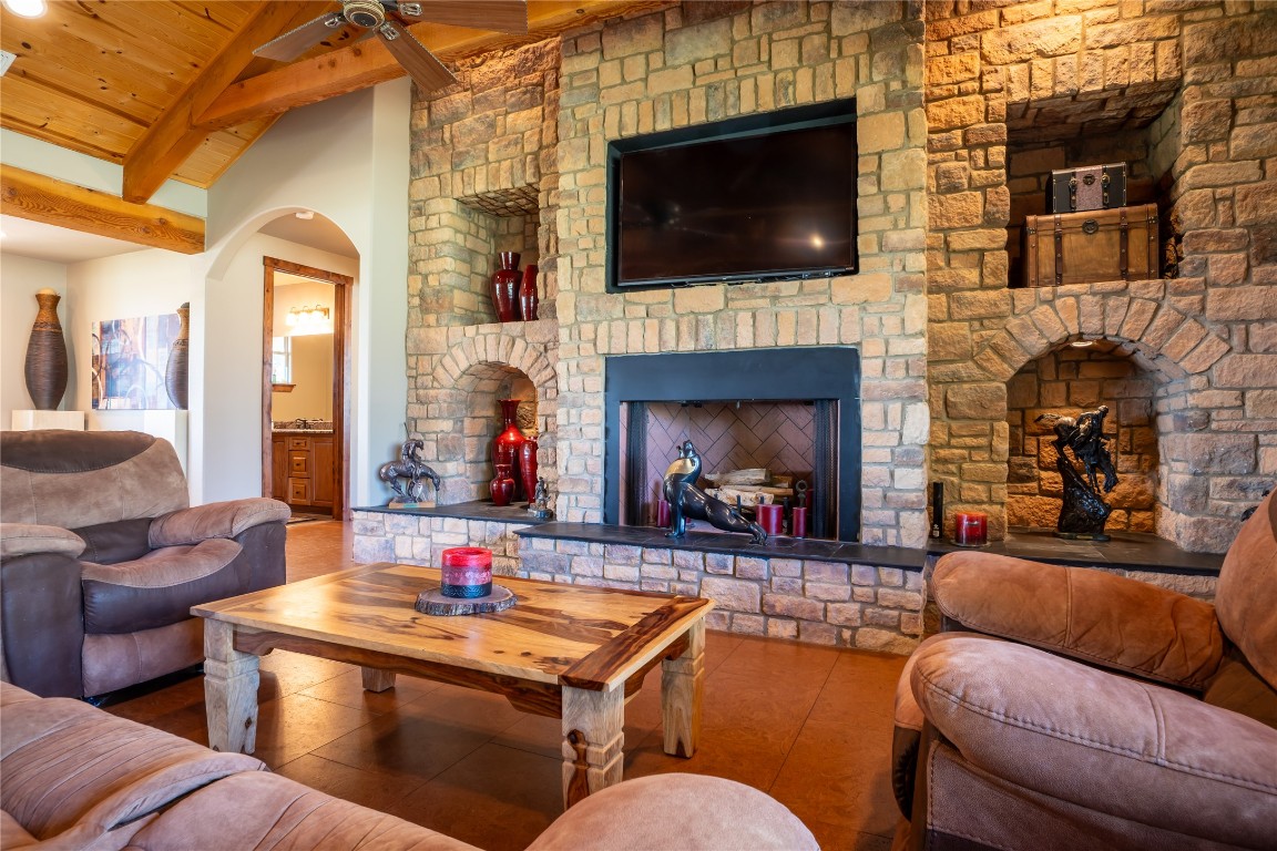 5525 Fm2340 Road Burnet, TX 78611 - Photo 15 of 39 Living area with a large fireplace and wood ceiling