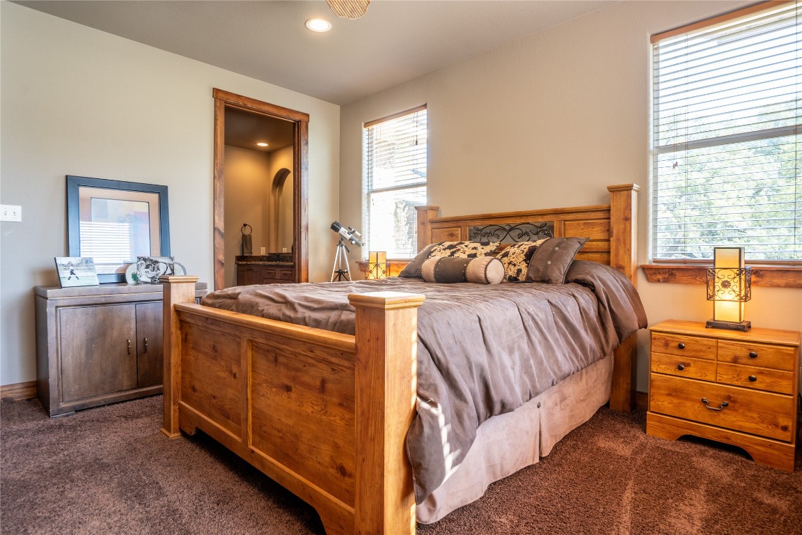 5525 Fm2340 Road Burnet, TX 78611 - Photo 19 of 39 Carpeted bedroom featuring recessed lighting