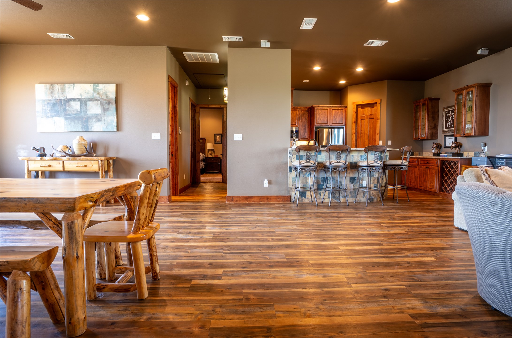 5525 Fm2340 Road Burnet, TX 78611 - Photo 27 of 39 a dining room with furniture wooden floor and a kitchen view