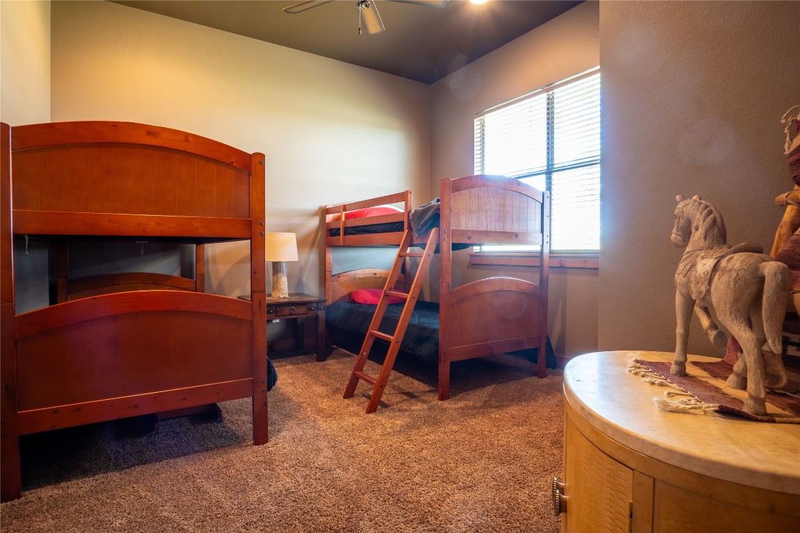 5525 Fm2340 Road Burnet, TX 78611 - Photo 28 of 39 Carpeted bedroom with a ceiling fan