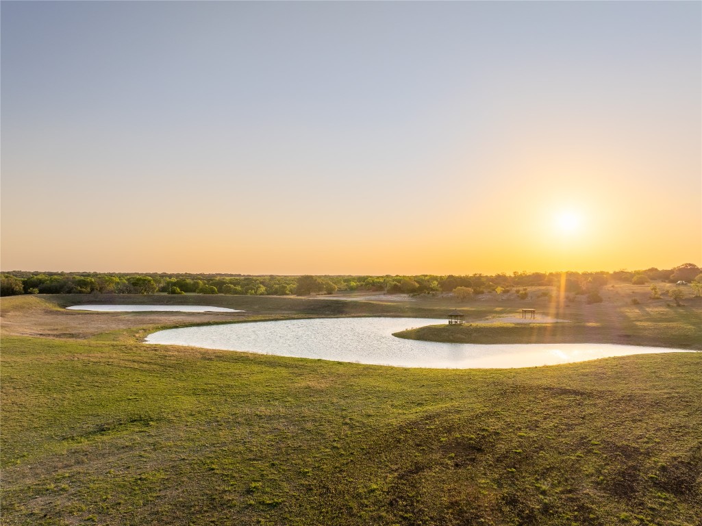 5525 Fm2340 Road Burnet, TX 78611 - Photo 7 of 39 View of property's community featuring a water view and a lawn