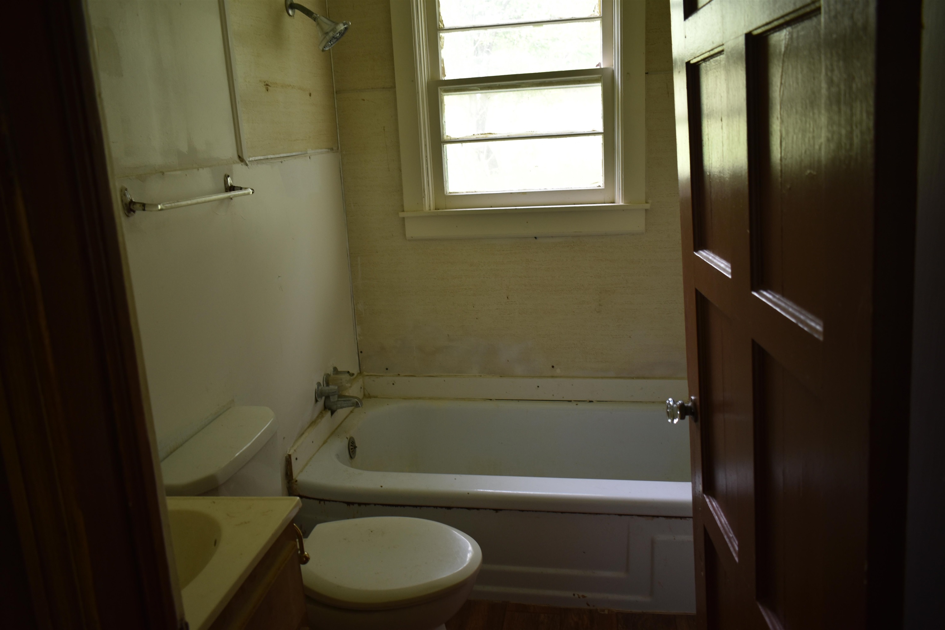 1600 Sticky Ridge Road Reagan, TN 38368 - Photo 17 of 17 a bathroom with a toilet and a bathtub