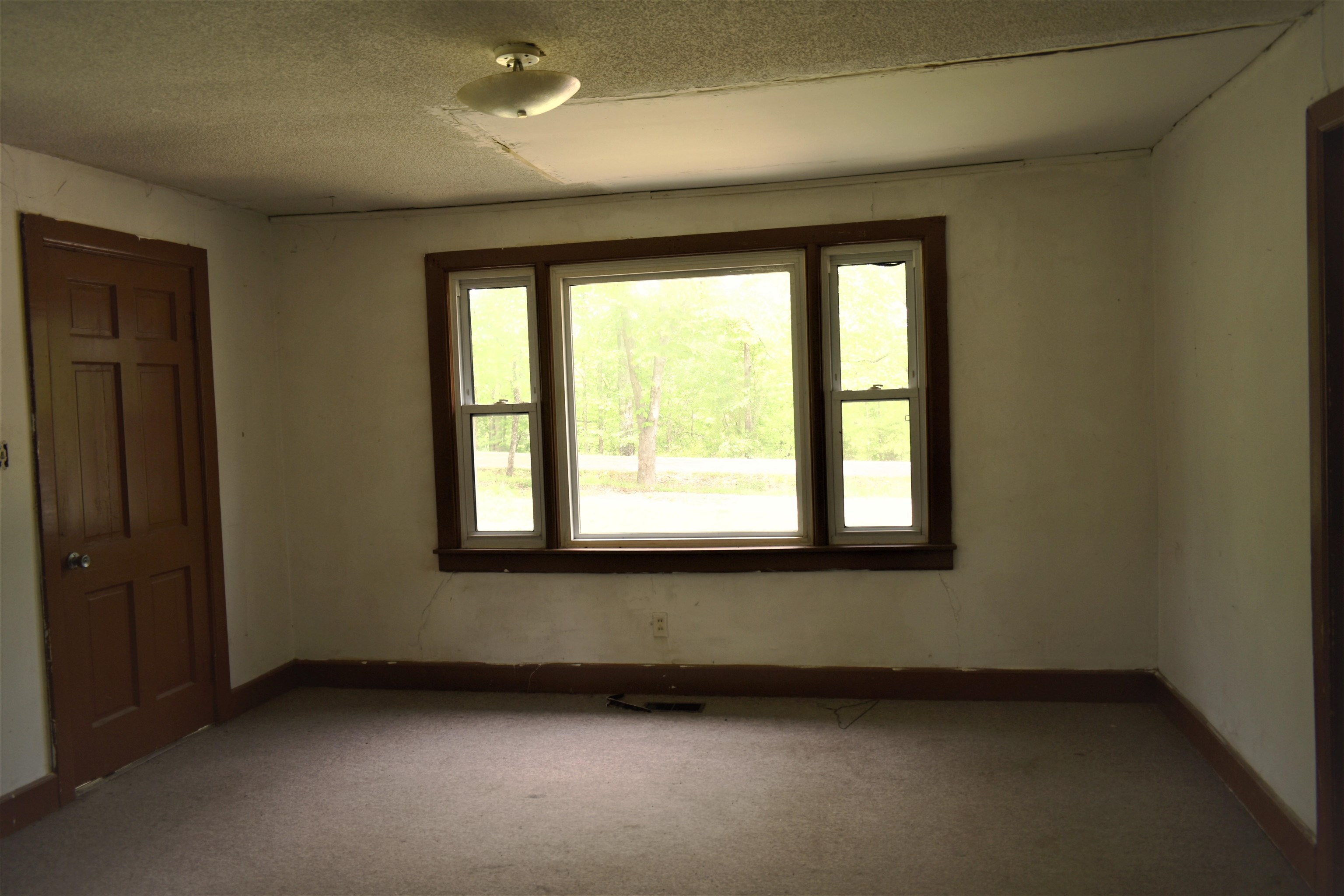 1600 Sticky Ridge Road Reagan, TN 38368 - Photo 9 of 17 an empty room with a window