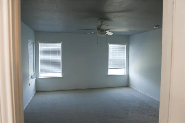 a view of empty room with windows