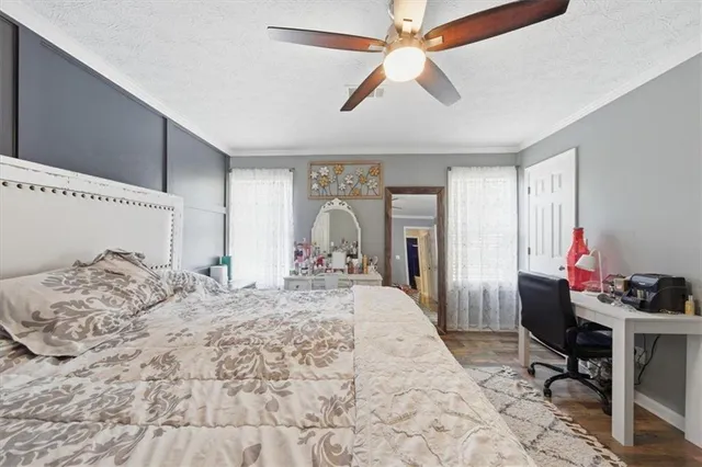 a bed room with a bed and a chandelier