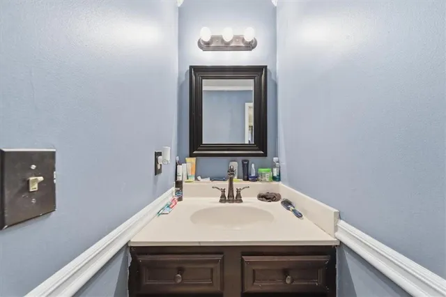 a bathroom with a sink and toilet