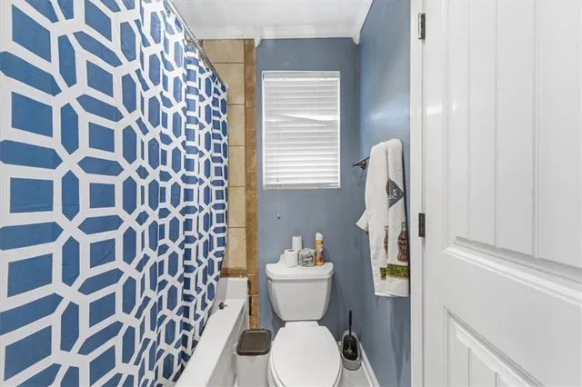 a front view of house with yard and trees