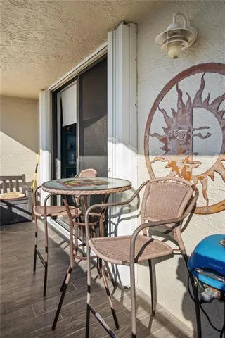 a view of a balcony with chairs