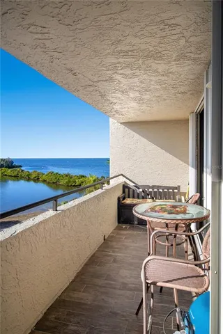 a view of balcony with furniture