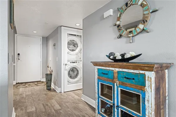 a view of a hallway with bathroom and shower