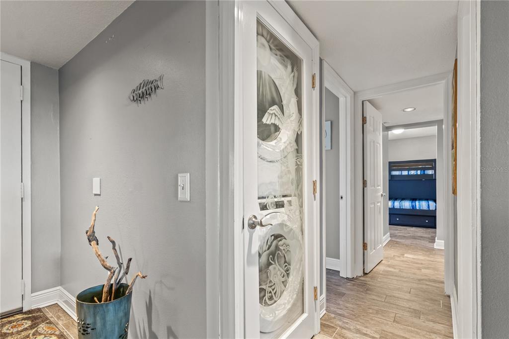 6035 Sea Ranch Drive, Unit 415 Hudson, FL 34667 - Photo 20 of 49 a view of a hallway with bathroom and shower
