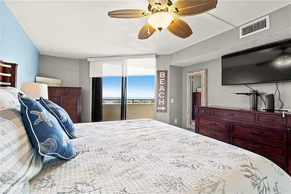 a bedroom with bed and wooden floor