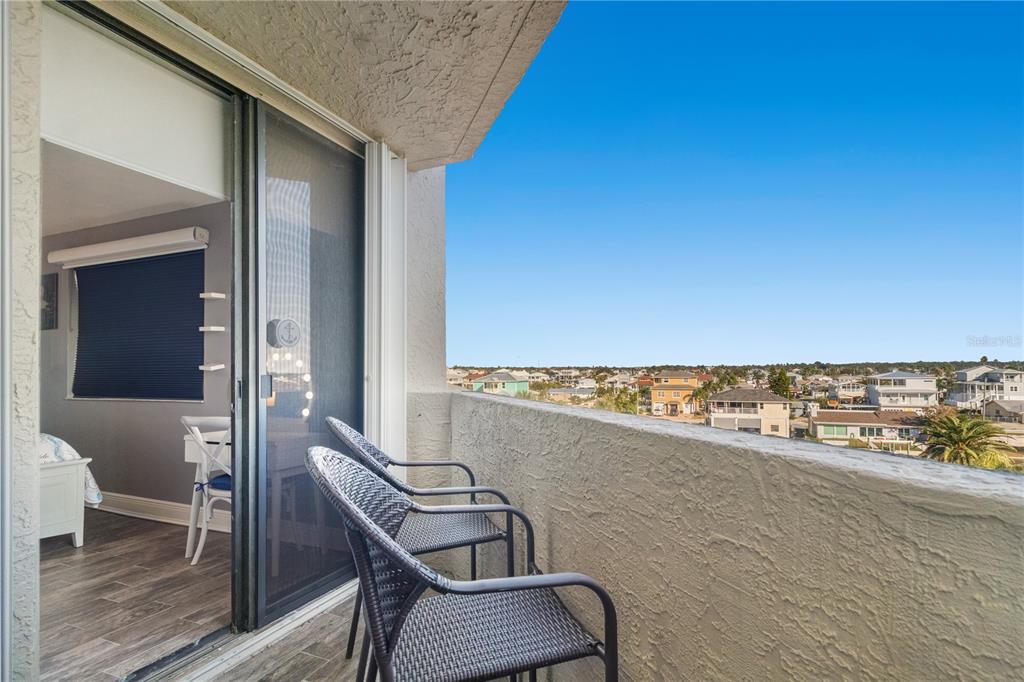 6035 Sea Ranch Drive, Unit 415 Hudson, FL 34667 - Photo 37 of 49 a view of a balcony with chair and table