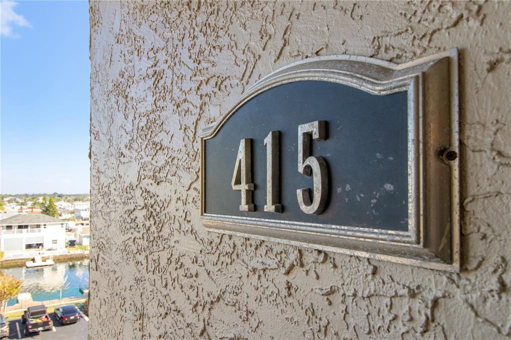 6035 Sea Ranch Drive, Unit 415 Hudson, FL 34667 - Photo 4 of 49 a front view of a house with parking