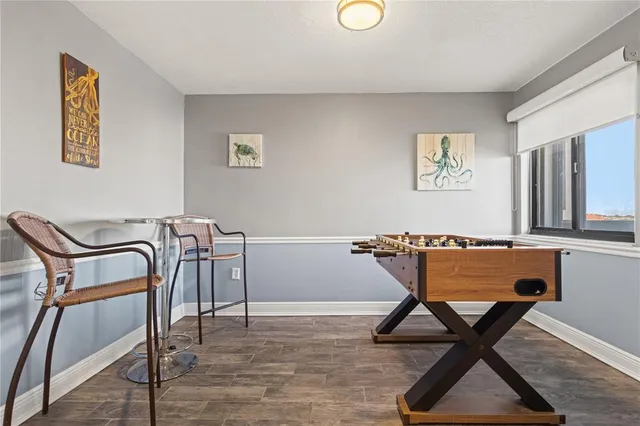 a workspace room with furniture and wooden floor