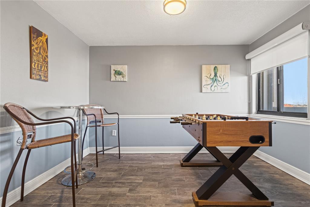 6035 Sea Ranch Drive, Unit 415 Hudson, FL 34667 - Photo 6 of 49 a workspace room with furniture and wooden floor