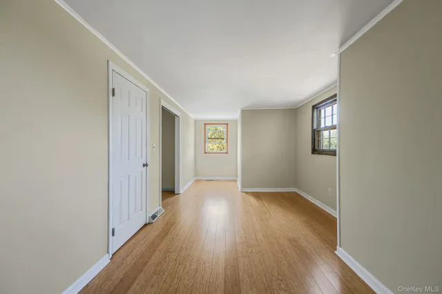 a bathroom with a sink and mirror with toilet