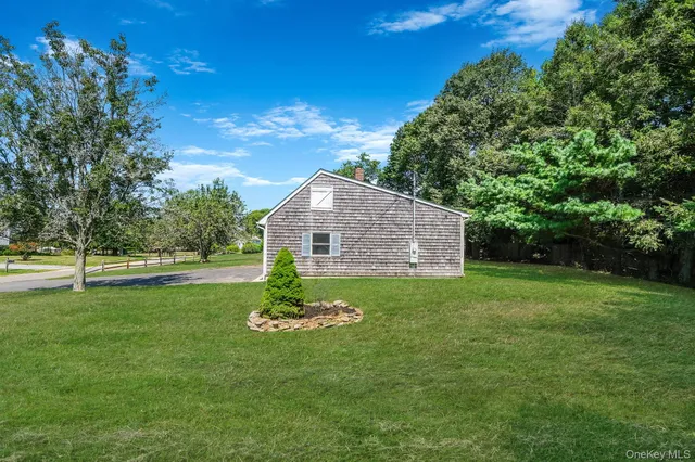 a view of a balcony with floor to ceiling windows with wooden floor