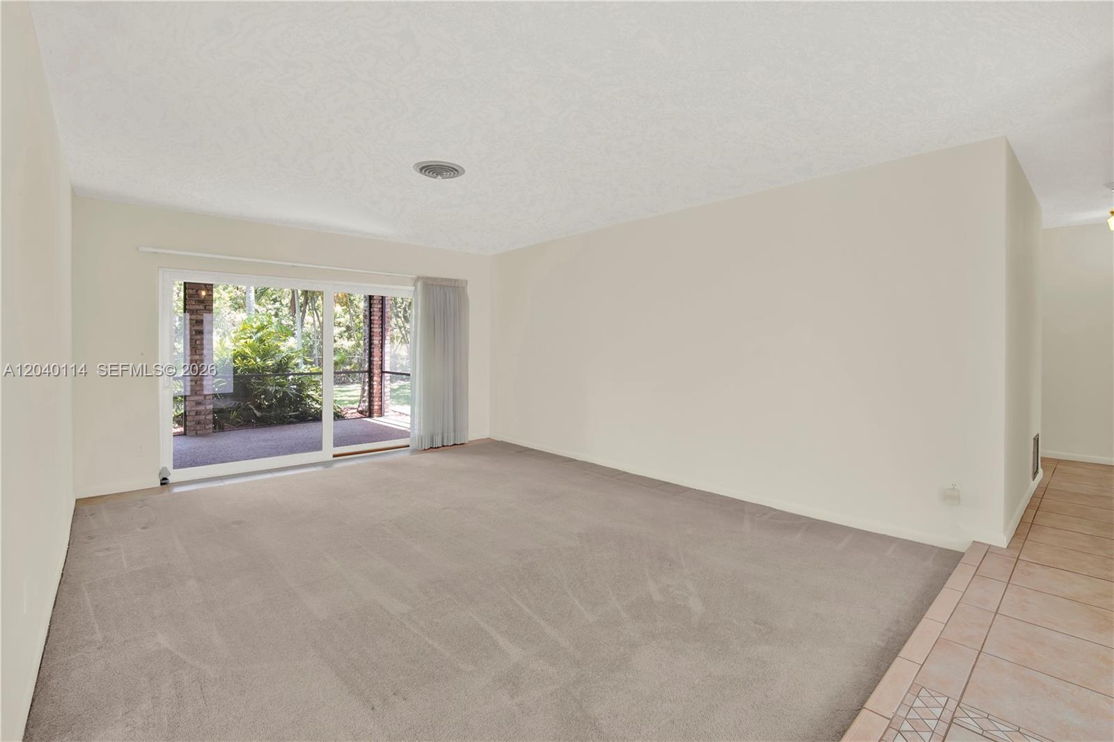 10435 Southwest 96th Street Miami, FL 33176 - Photo 6 of 44 Living room opens unto the screened patio