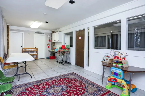 a view of a livingroom with furniture and a potted plant