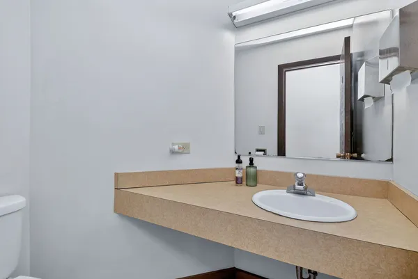 a view of a livingroom with furniture and a window