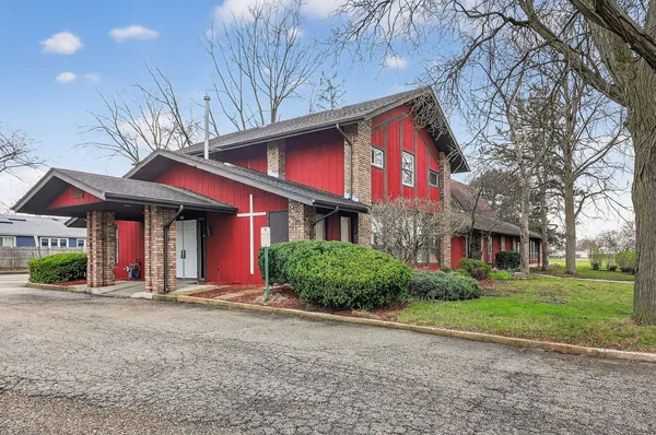 a view of a building with a yard