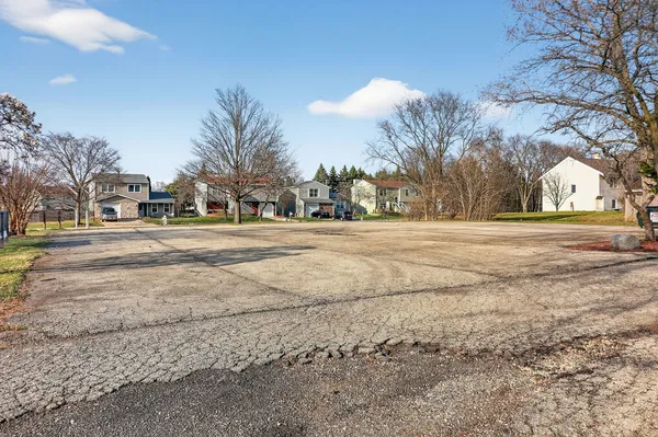 a picture of a bench in front of a wall