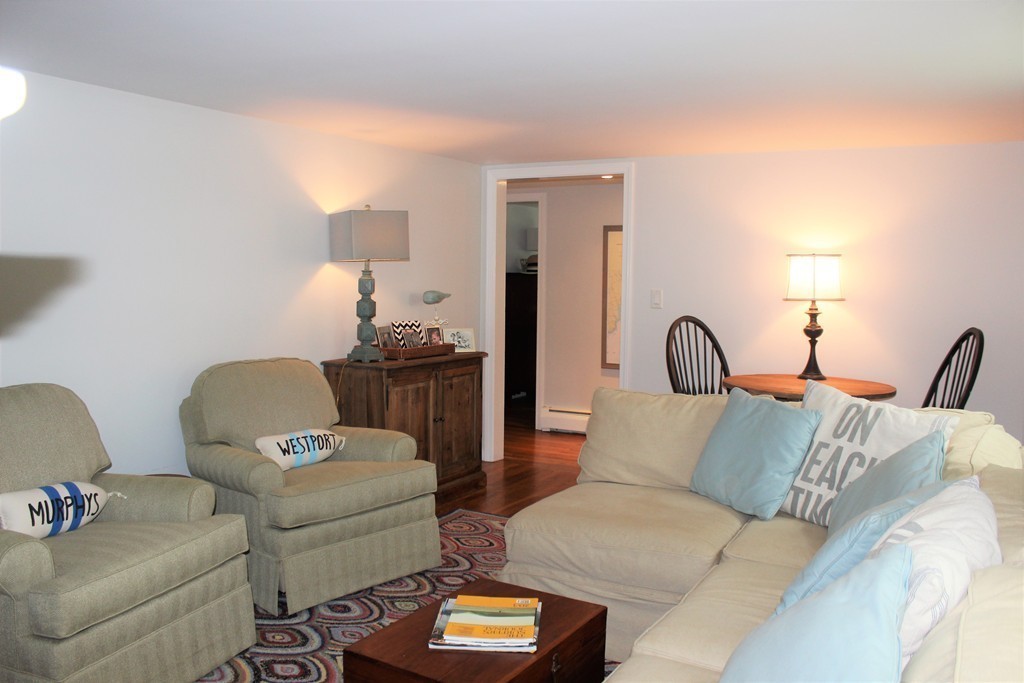 1672 Main Road Westport, MA 02790 - Photo 14 of 26 a living room with furniture and a lamp