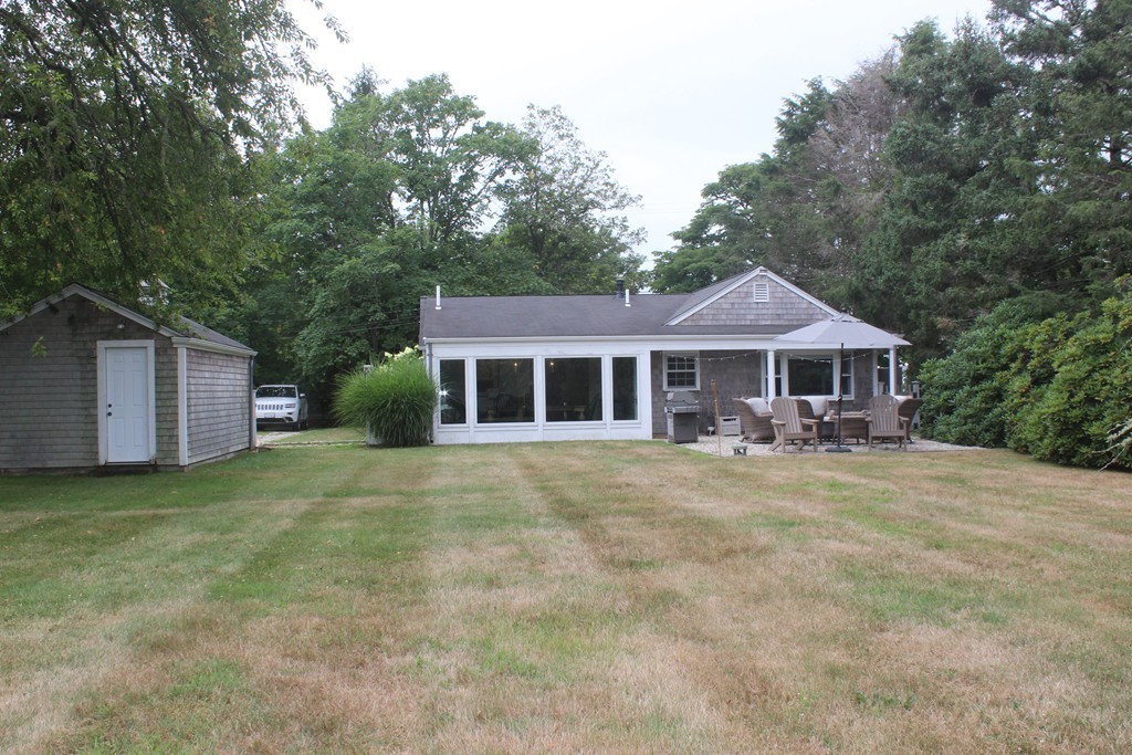 1672 Main Road Westport, MA 02790 - Photo 5 of 26 a front view of a house with a garden