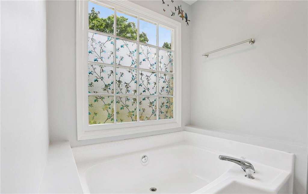9725 Kings Road Gainesville, GA 30506 - Photo 18 of 32 a bathroom with a bathtub and shower
