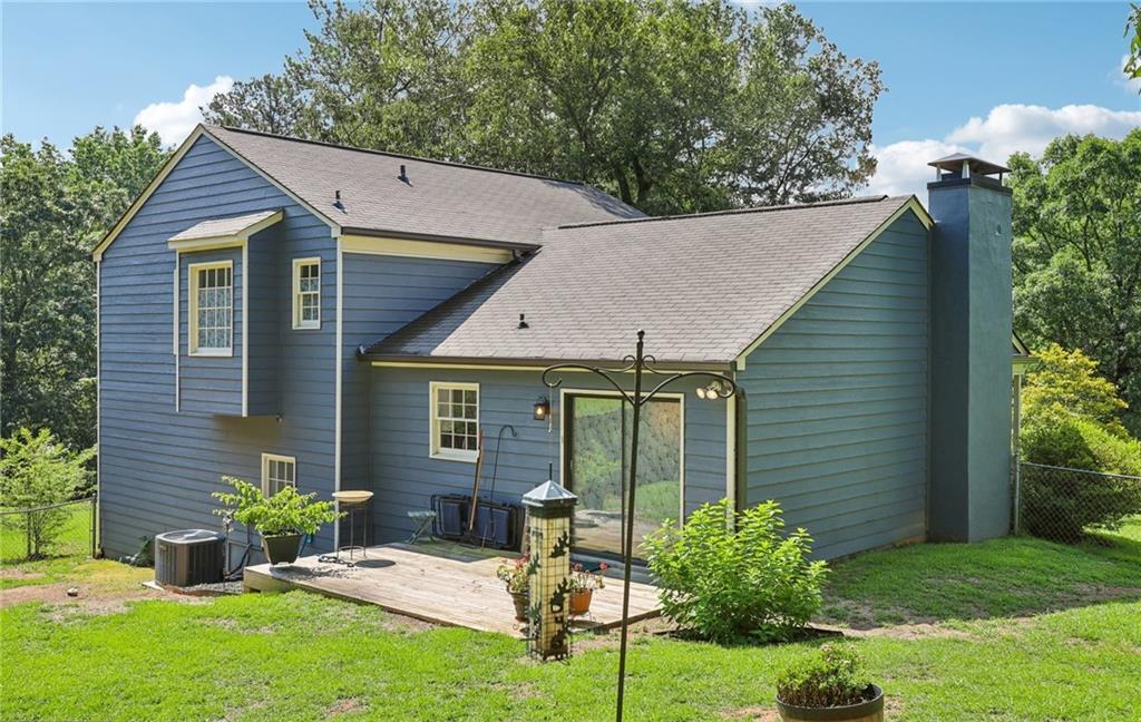 9725 Kings Road Gainesville, GA 30506 - Photo 2 of 32 a view of a house with backyard and sitting area