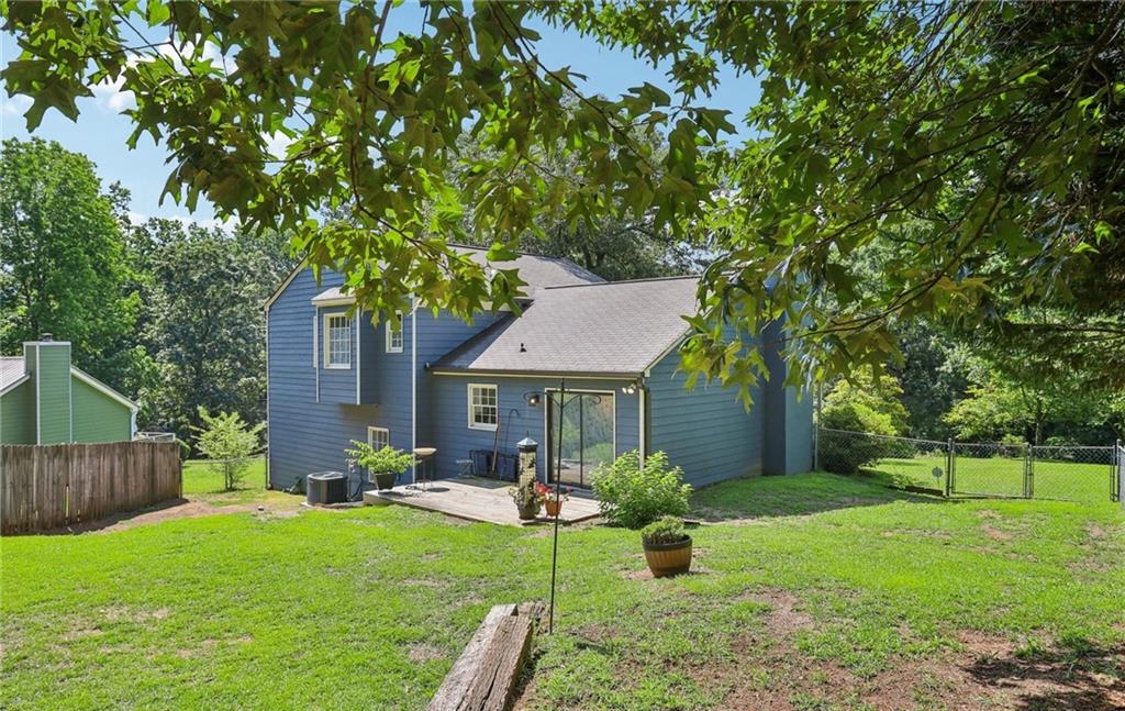 9725 Kings Road Gainesville, GA 30506 - Photo 5 of 32 a front view of a house with garden
