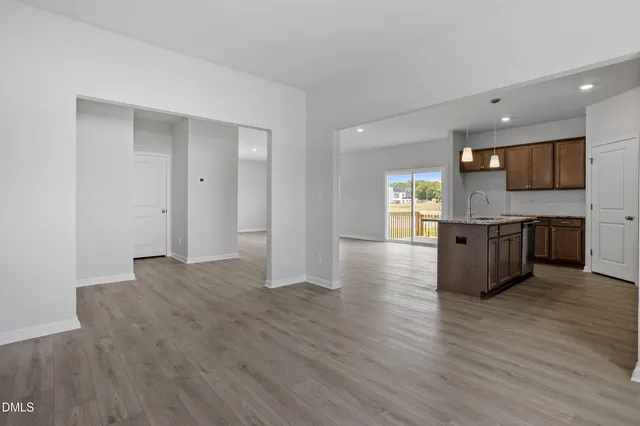 a view of a kitchen cabinets and wooden floor