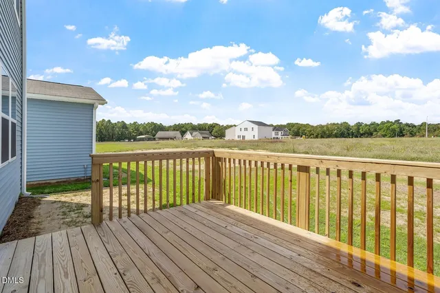a view of wooden balcony with outdoor space