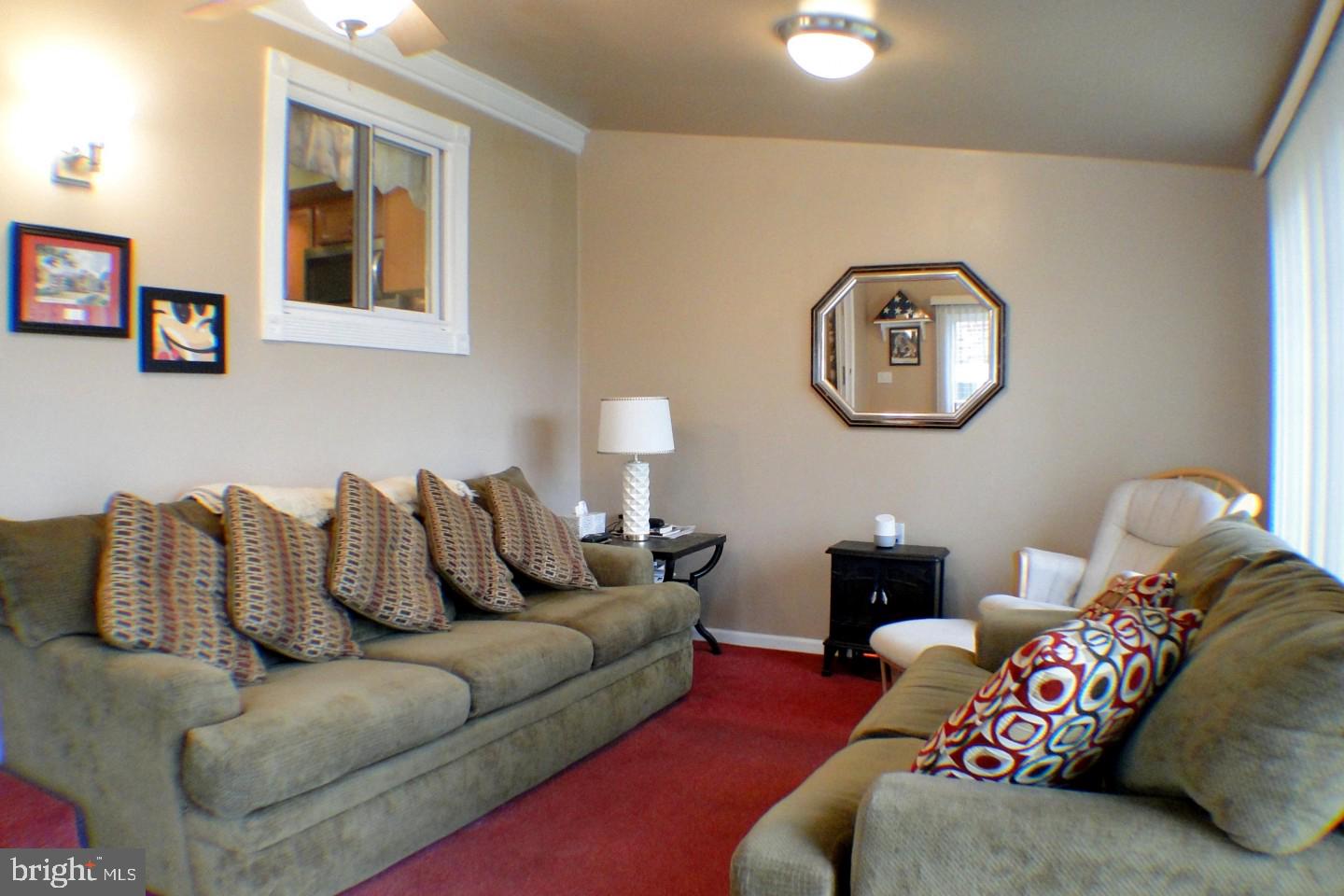 1166 Morefield Road Philadelphia, PA 19115 - Photo 14 of 35 a living room with furniture and painting on the wall