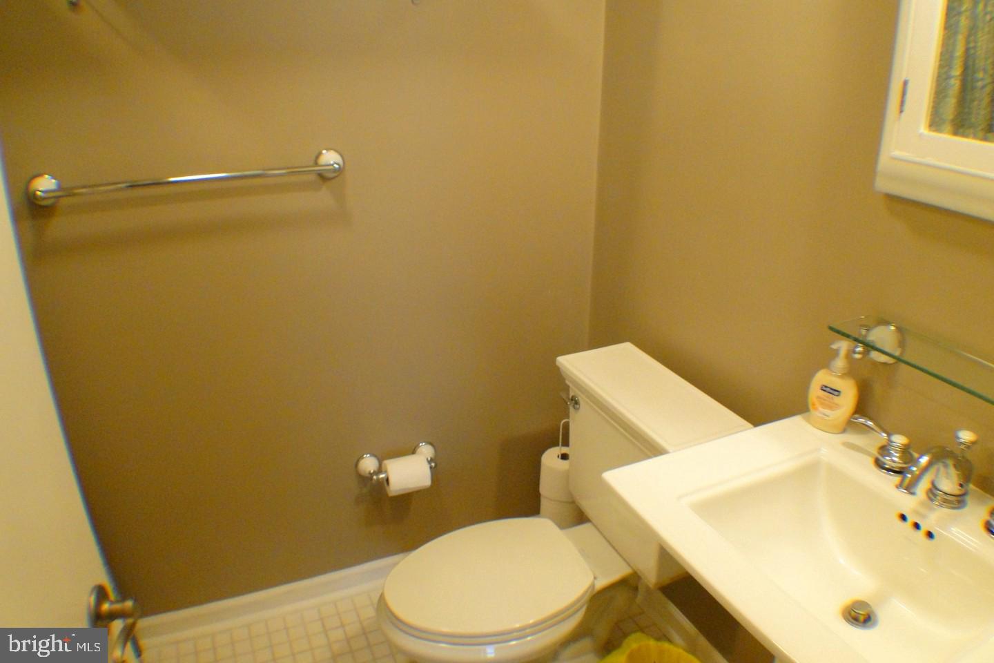 1166 Morefield Road Philadelphia, PA 19115 - Photo 22 of 35 a bathroom with a sink and a toilet