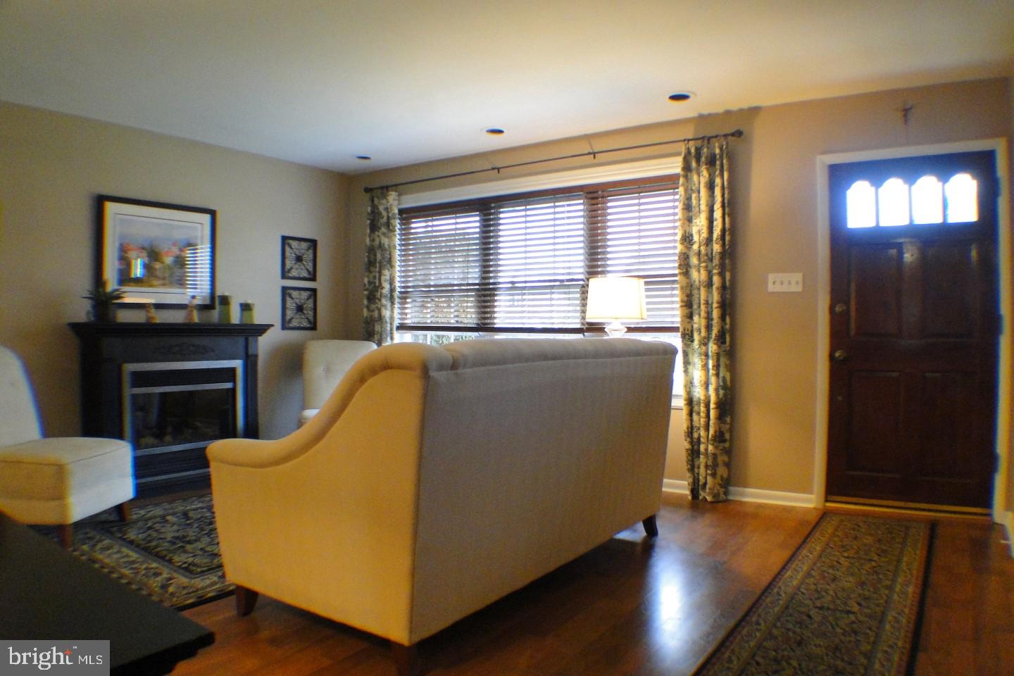1166 Morefield Road Philadelphia, PA 19115 - Photo 8 of 35 a living room with furniture and a fireplace