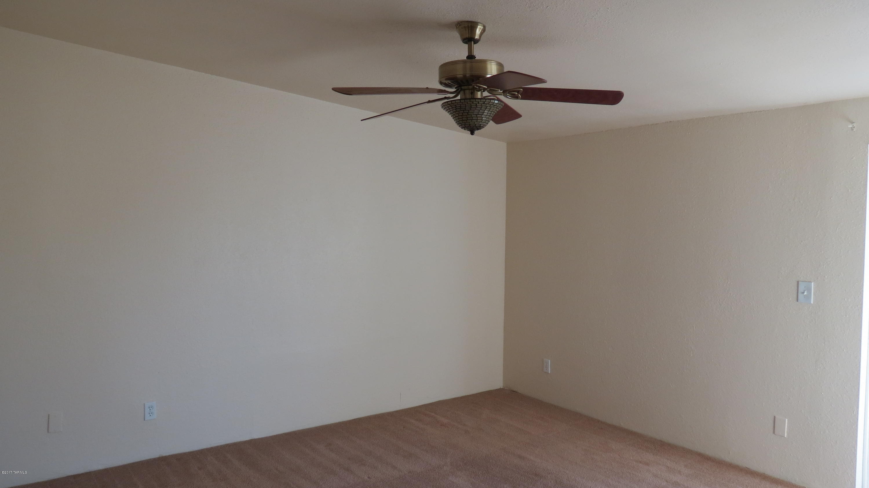 6601 North Mona Lisa Road Tucson, AZ 85741 - Photo 9 of 23 a view of a small space with a fan