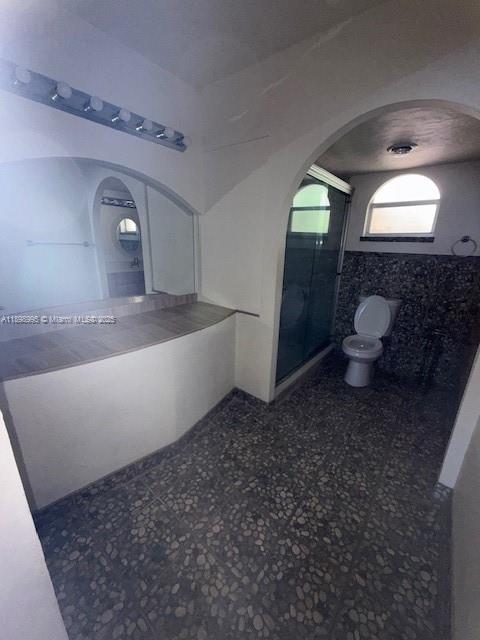 406 Northwest 68th Avenue, Unit 411 Plantation, FL 33317 - Photo 11 of 12 a bathroom with a sink and mirror