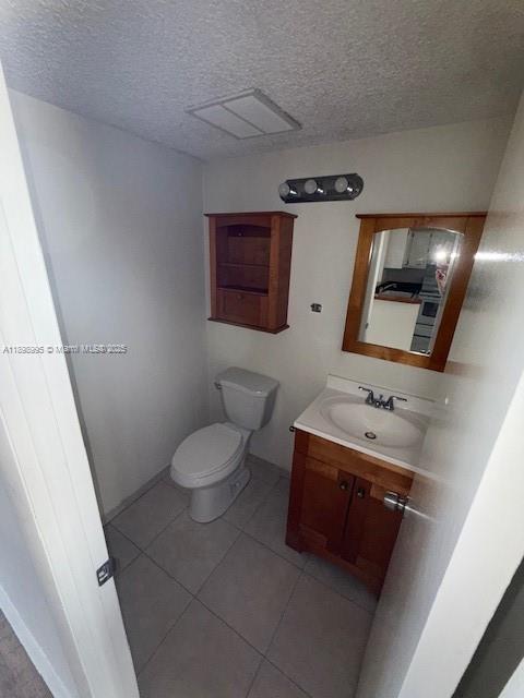 406 Northwest 68th Avenue, Unit 411 Plantation, FL 33317 - Photo 12 of 12 a bathroom with a toilet sink and mirror