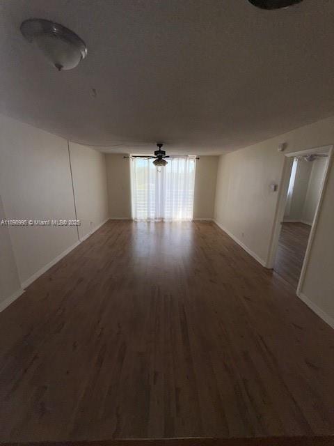 406 Northwest 68th Avenue, Unit 411 Plantation, FL 33317 - Photo 3 of 12 an empty room with wooden floor and windows