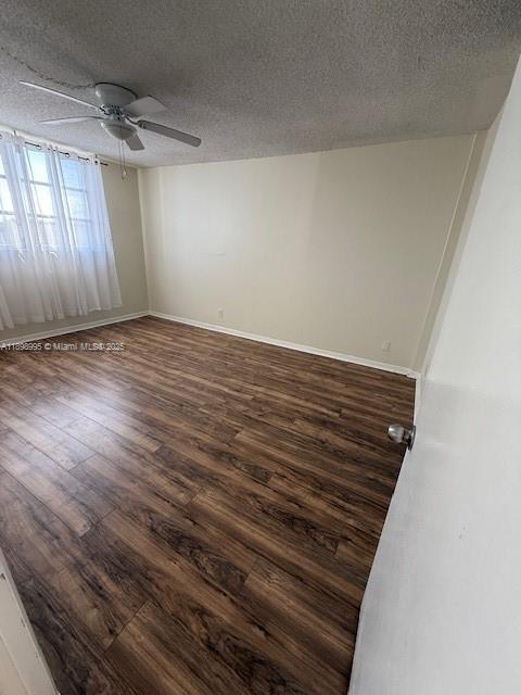 406 Northwest 68th Avenue, Unit 411 Plantation, FL 33317 - Photo 4 of 12 a view of an empty room with wooden floor and a window