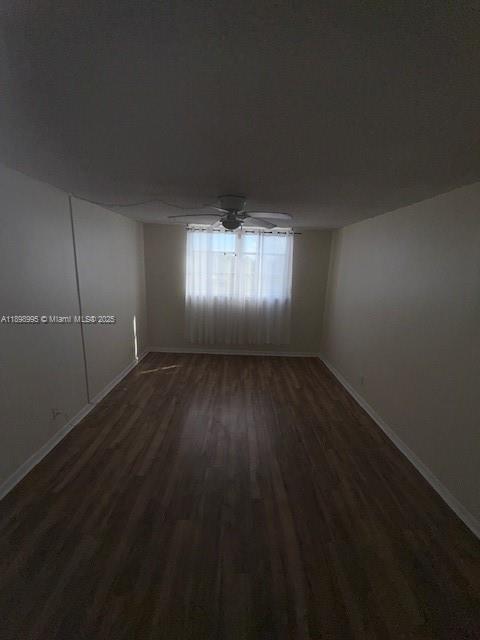 406 Northwest 68th Avenue, Unit 411 Plantation, FL 33317 - Photo 6 of 12 an empty room with wooden floor and windows