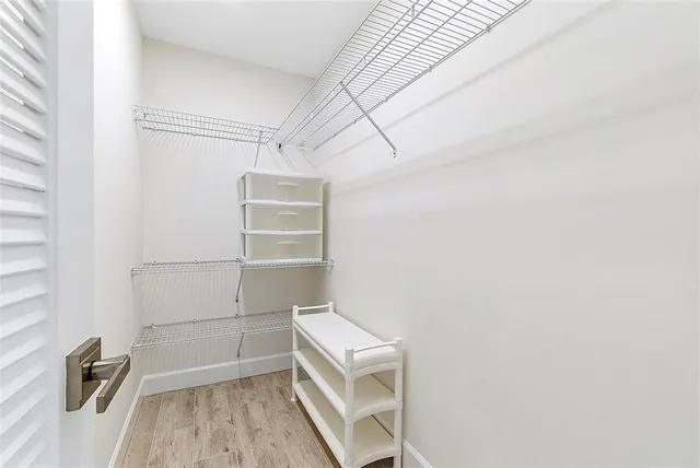 a view of an empty walk in closet