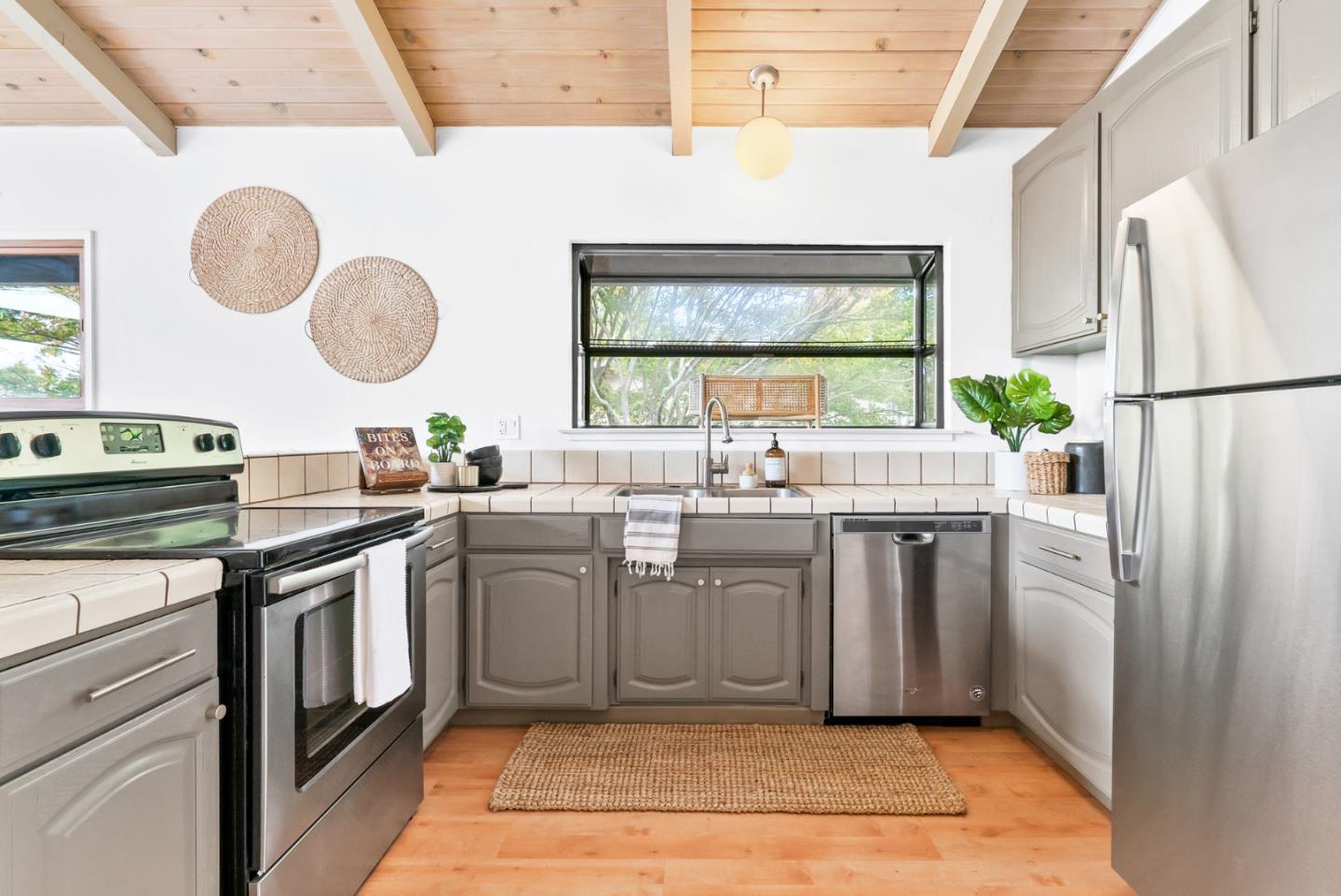 215 Martin Drive Aptos, CA 95003 - Photo 26 of 51 a kitchen with a sink cabinets and stainless steel appliances