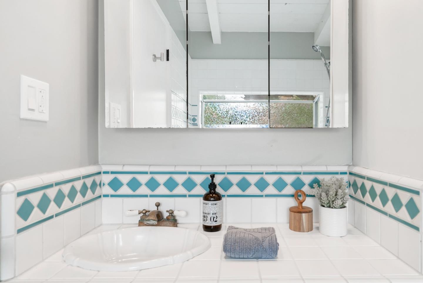 215 Martin Drive Aptos, CA 95003 - Photo 36 of 51 a kitchen with a table and chairs