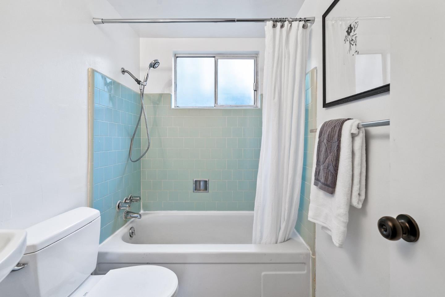 215 Martin Drive Aptos, CA 95003 - Photo 43 of 51 a bathroom with a shower a toilet and a tub