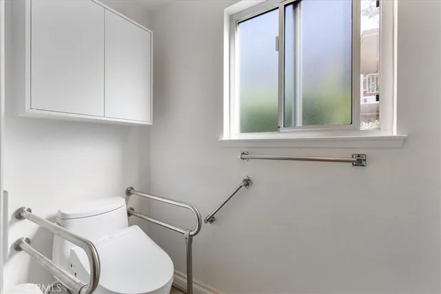 a bathroom with a toilet and a sink